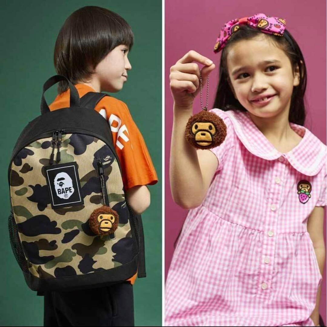 BAPE KIDS® BY A BATHING APE® 2022 SPRING/SUMMER COLLECTION CAMO BACKPACK & MILO CHARM BOOK