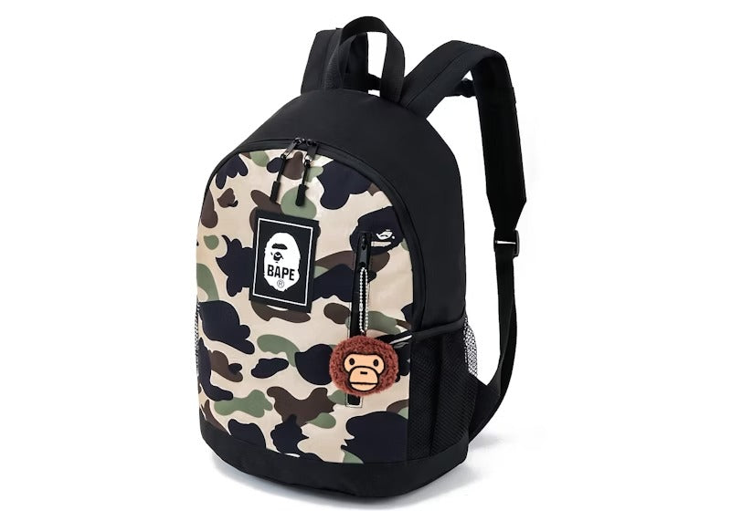 BAPE KIDS® BY A BATHING APE® 2022 SPRING/SUMMER COLLECTION CAMO BACKPACK & MILO CHARM BOOK